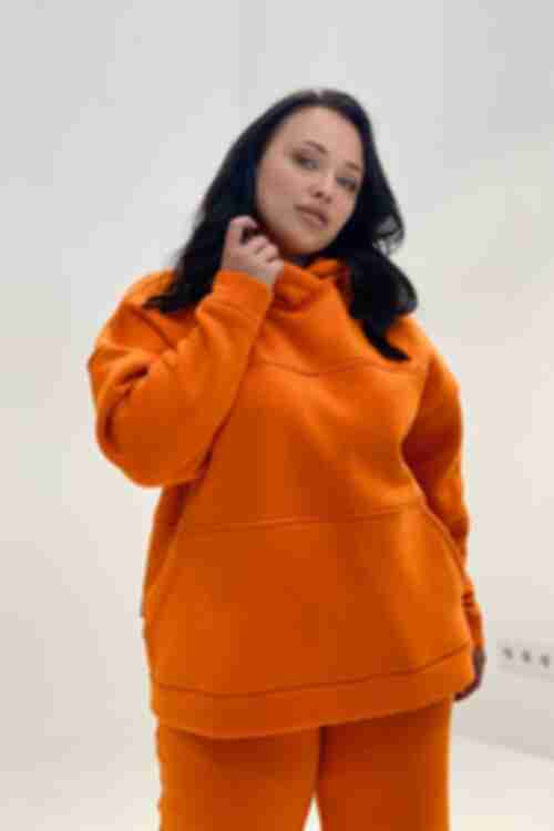 Orange knitted suit with hoodie with a yoke and trousers plus size