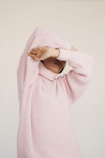 Light pink knitted sweater with a turtleneck