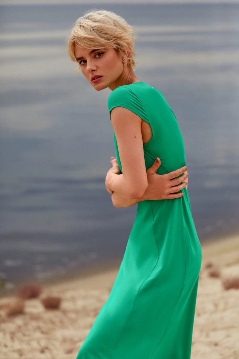 Green midaxi dress with a slit and a cutout on the back made of dense staple cotton