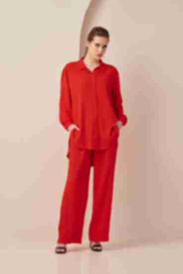 Віскозний костюм блуза та брюки палацо жатка червоний