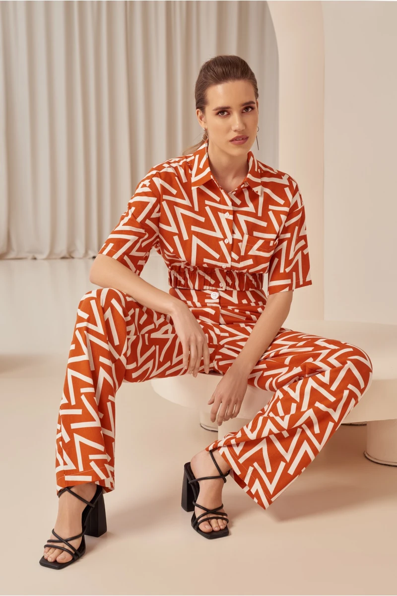 Orange straight linen trousers in designer print