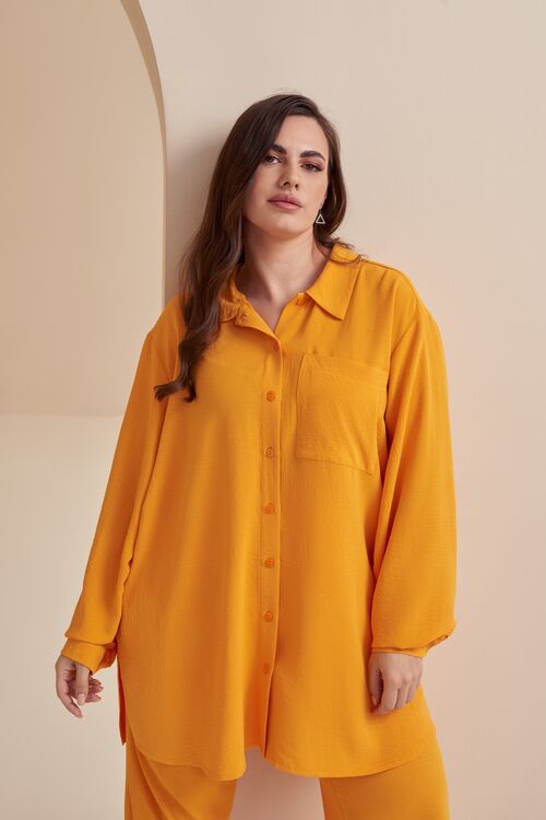 Bright orange blouse made of crushed viscose plus size