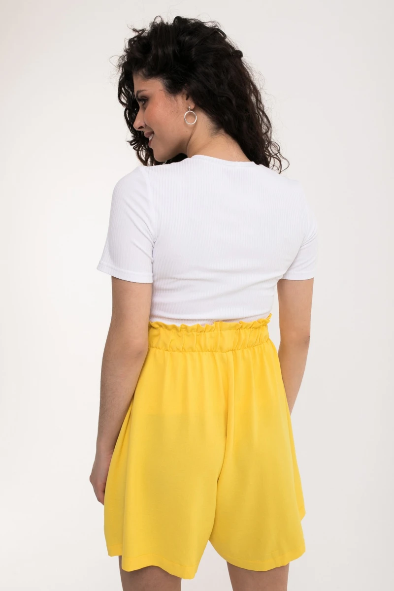 Bright yellow shorts made of crushed viscose