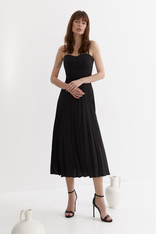 Black demi dress with corset top and pleated skirt