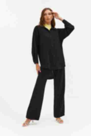 Black suit with blouse and palazzo trousers made of crushed viscose