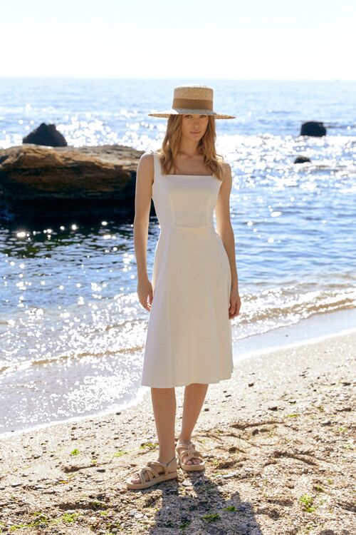 Sundress with wide straps with a trapeze skirt linen milky