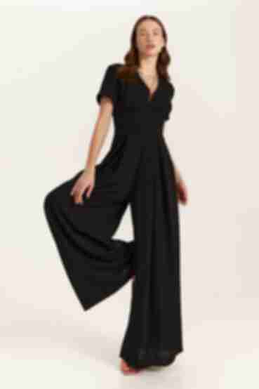 Black viscose reaper jumpsuit with a sewn-in belt