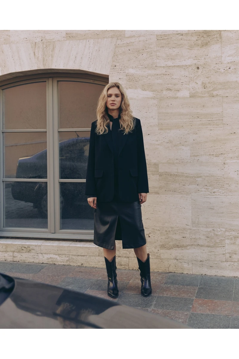 Black midi eco-leather skirt with slit