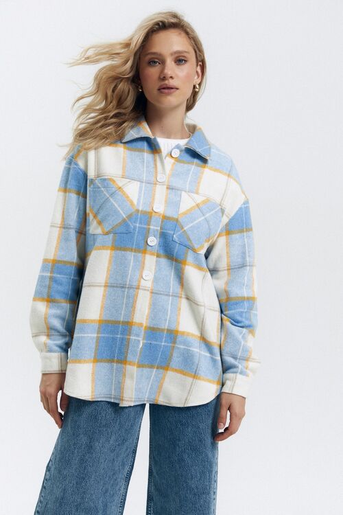 Oversized yellow check shirt on blue and milk