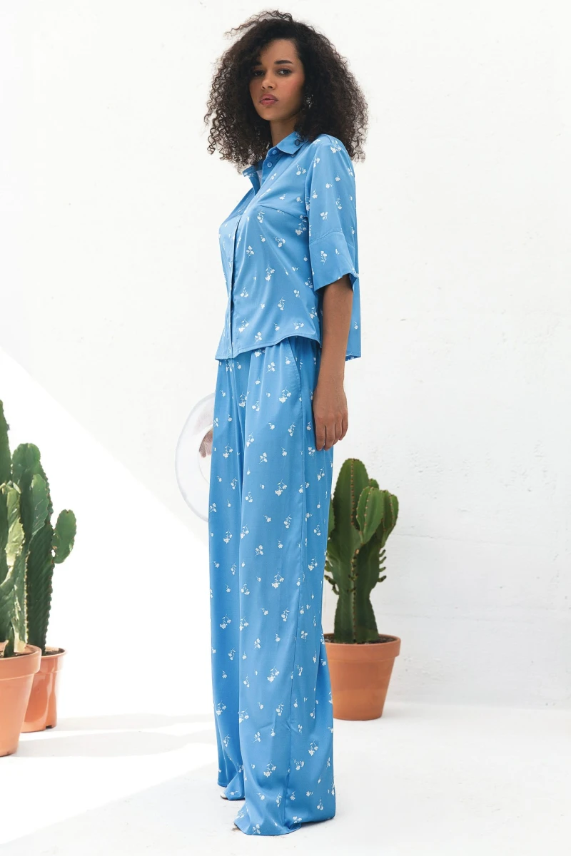 Suit shortened shirt and straight pants artificial silk white bouquets on blue