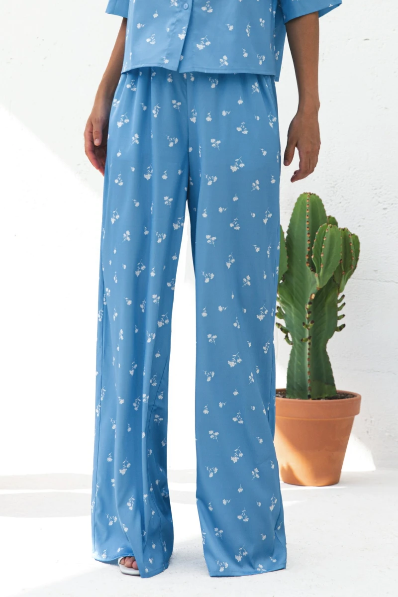 Suit shortened shirt and straight pants artificial silk white bouquets on blue