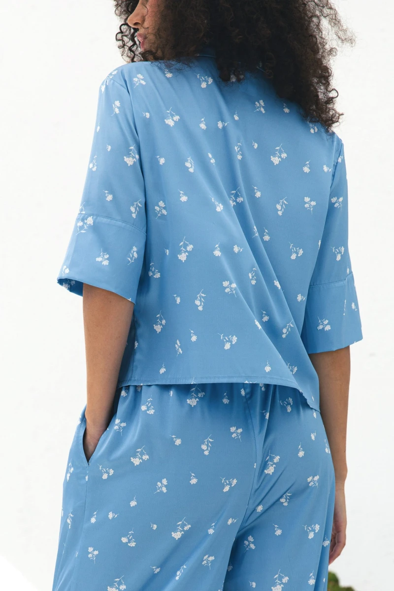 Suit shortened shirt and straight pants artificial silk white bouquets on blue