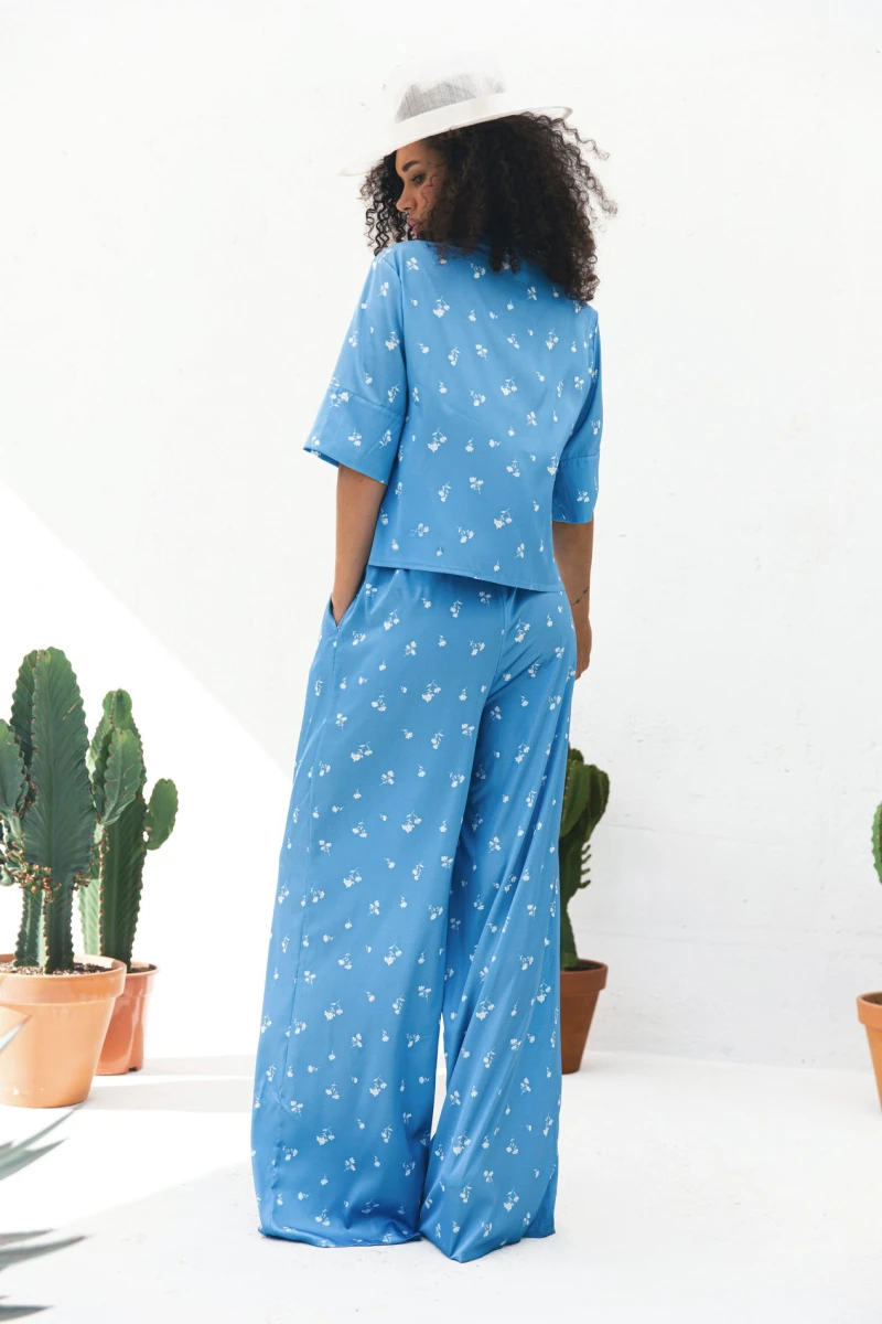 Suit shortened shirt and straight pants artificial silk white bouquets on blue