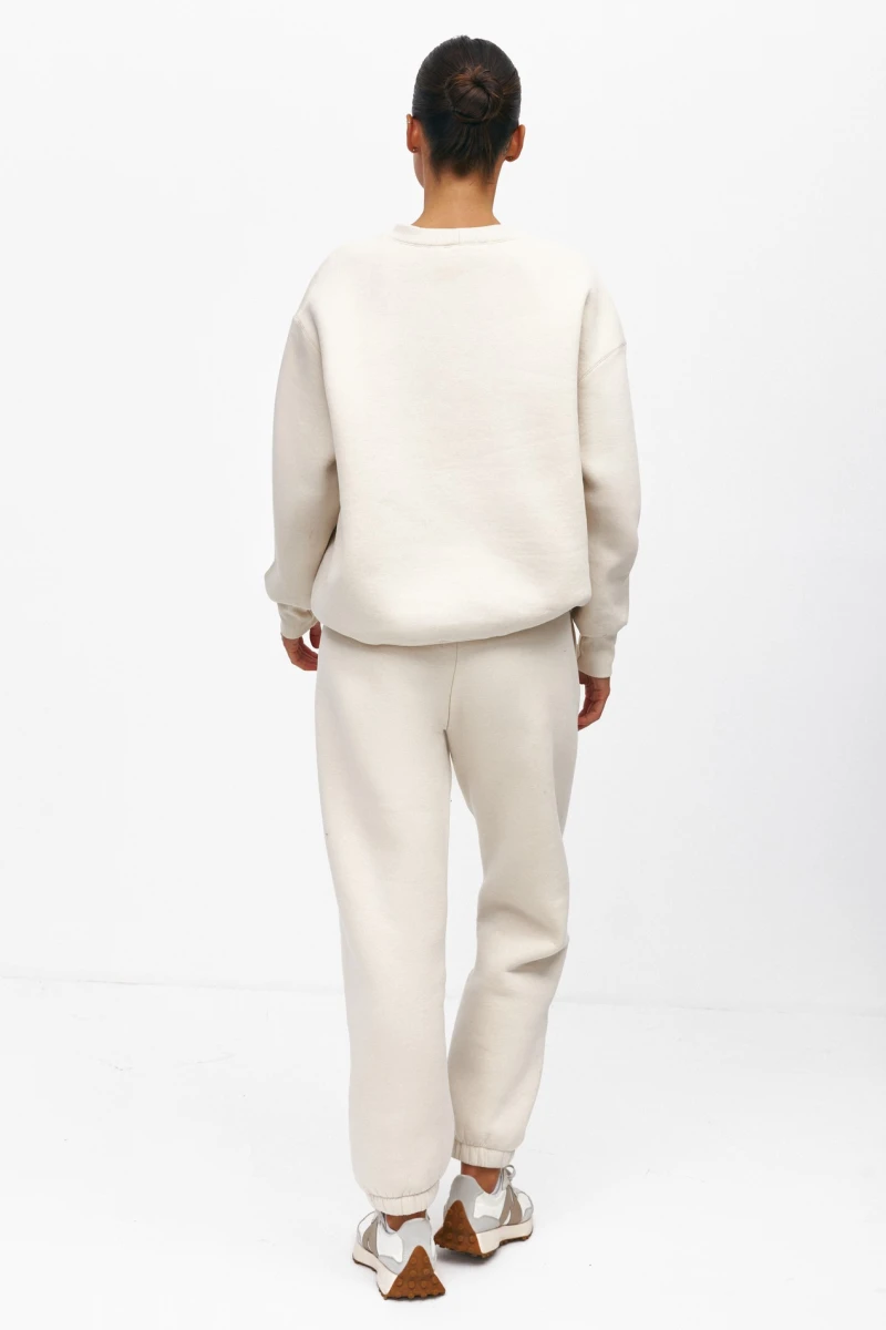 Beige fleece-lined knit sweatshirt