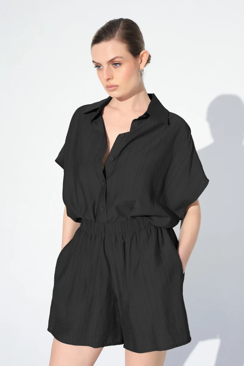 Black shirt and shorts suit
