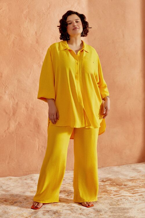 Bright yellow palazzo pants made of crushed viscose plus size