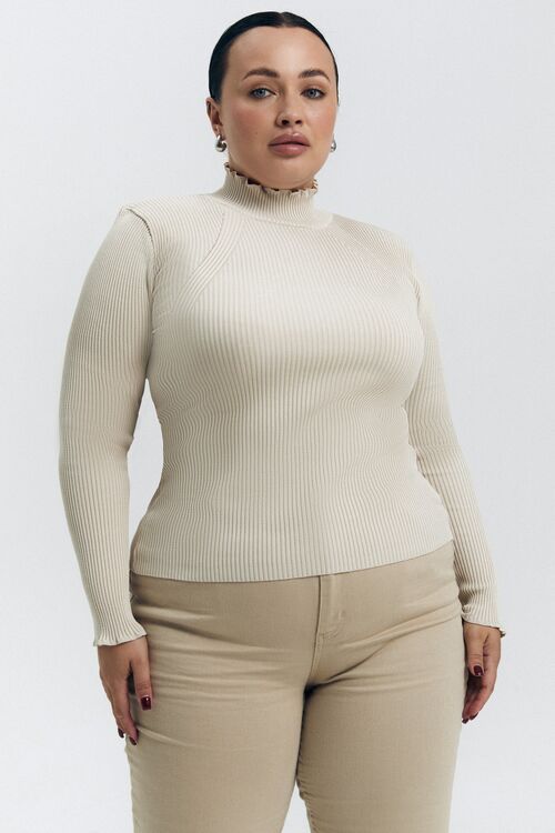 The golf is knitted with an openwork edge  in  beige plus size